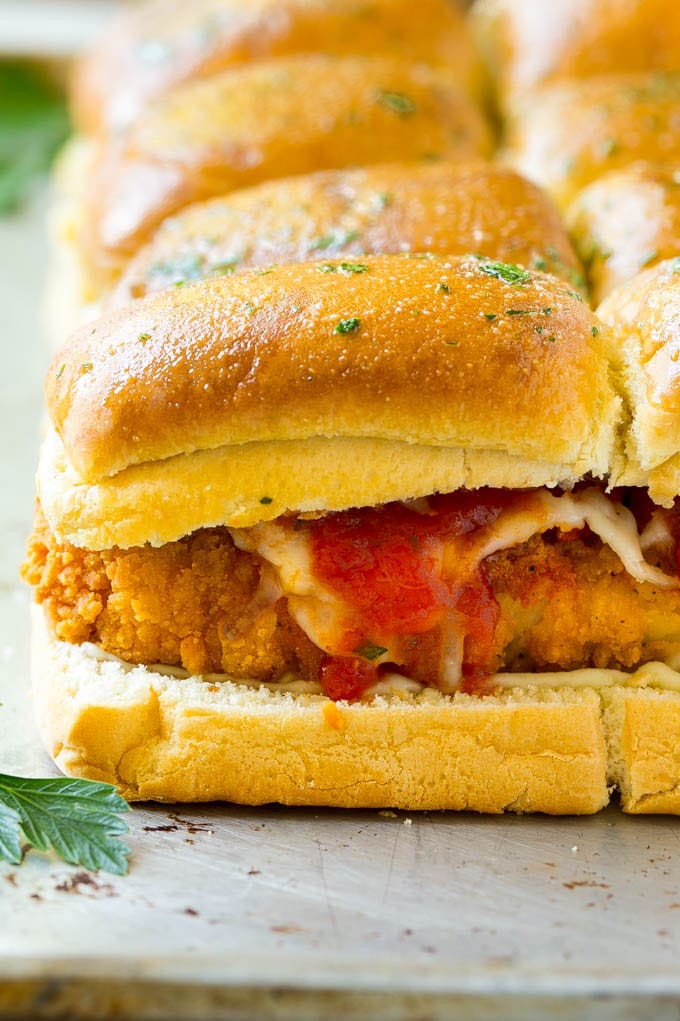 Crispy chicken with tomato sauce and cheese on slider buns.