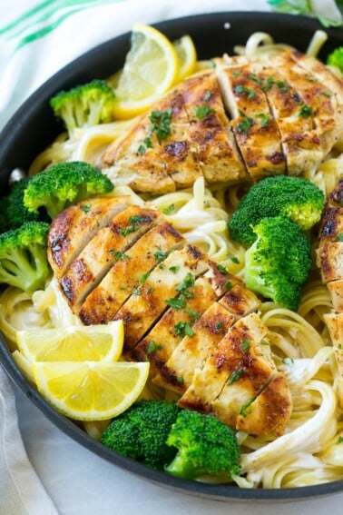 A pan of chicken and broccoli pasta in a creamy lemon sauce.