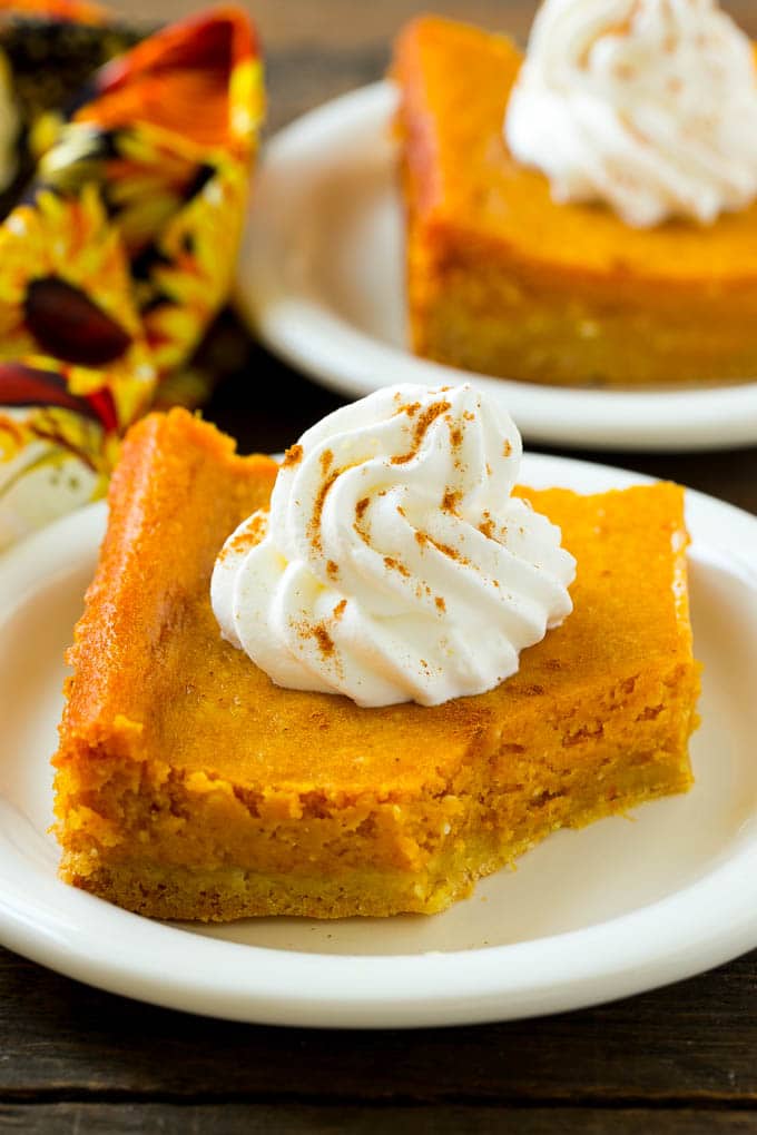 A slice of pumpkin butter cake with a bite taken out of it.