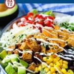 This BBQ chicken salad is a fresh and colorful combination of grilled BBQ chicken, veggies, cheese, beans and tortilla strips, all tossed in ranch dressing.