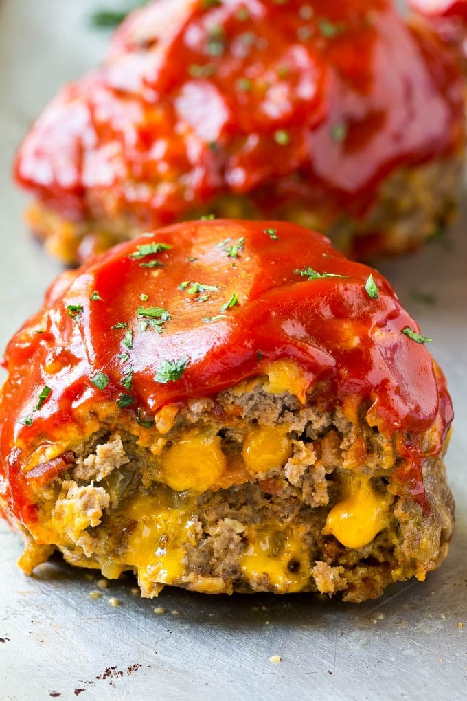 A cross section of an individual sized cheeseburger meatloaf.