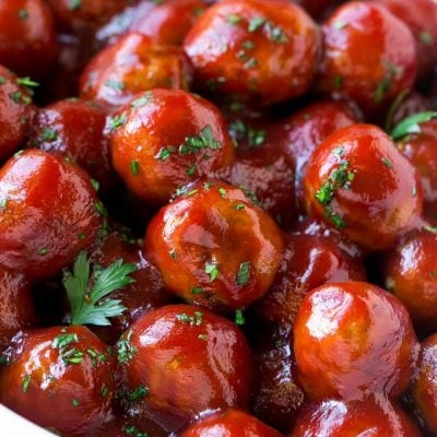 A crock pot full of cranberry meatballs.