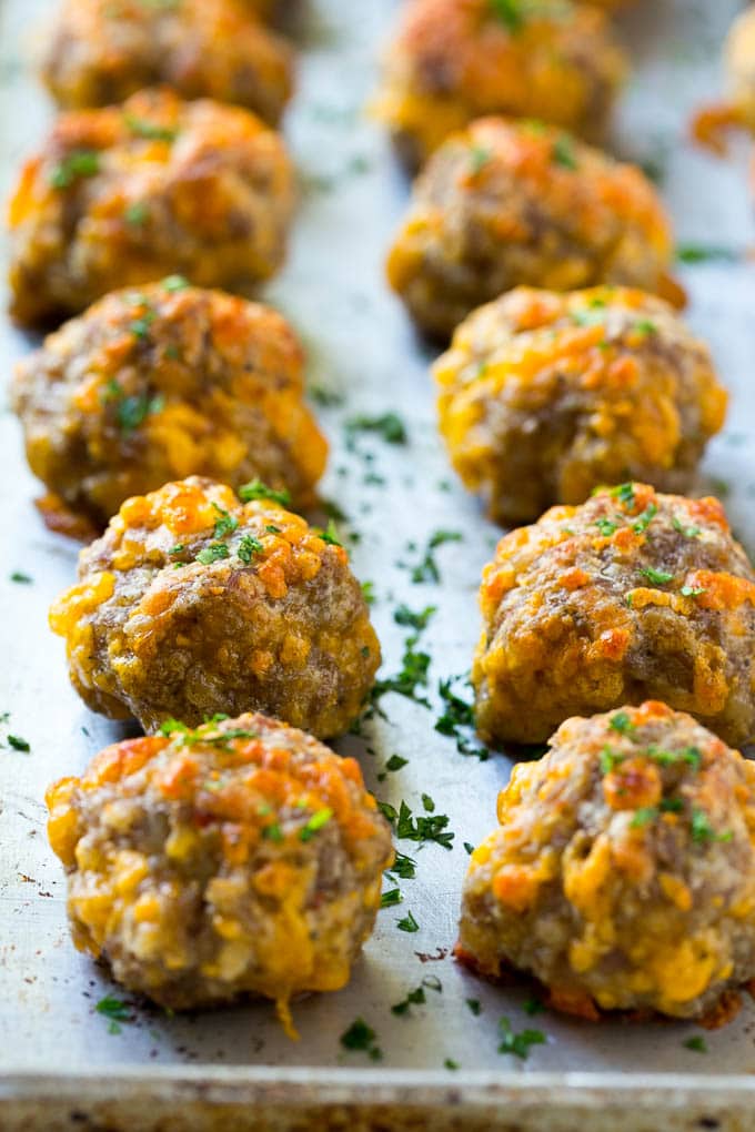 Cooked meatballs on a baking sheet.