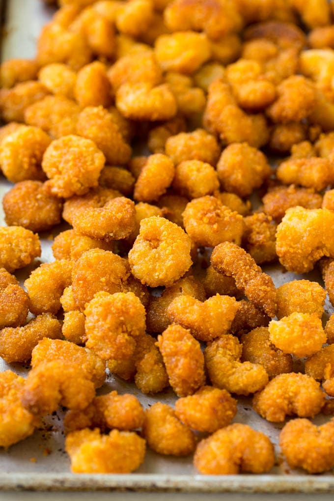 A pan of cooked popcorn shrimp.