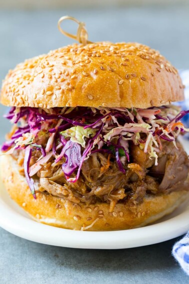 A pulled pork sandwich topped with slaw.