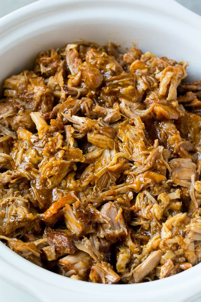 A slow cooker full of pulled pork.