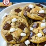 These S'mores cookies are chewy graham cracker cookies loaded with gooey marshmallows and milk chocolate.