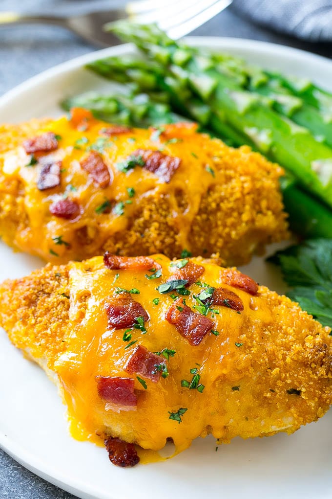 Baked Ranch Chicken on a plate with asparagus.