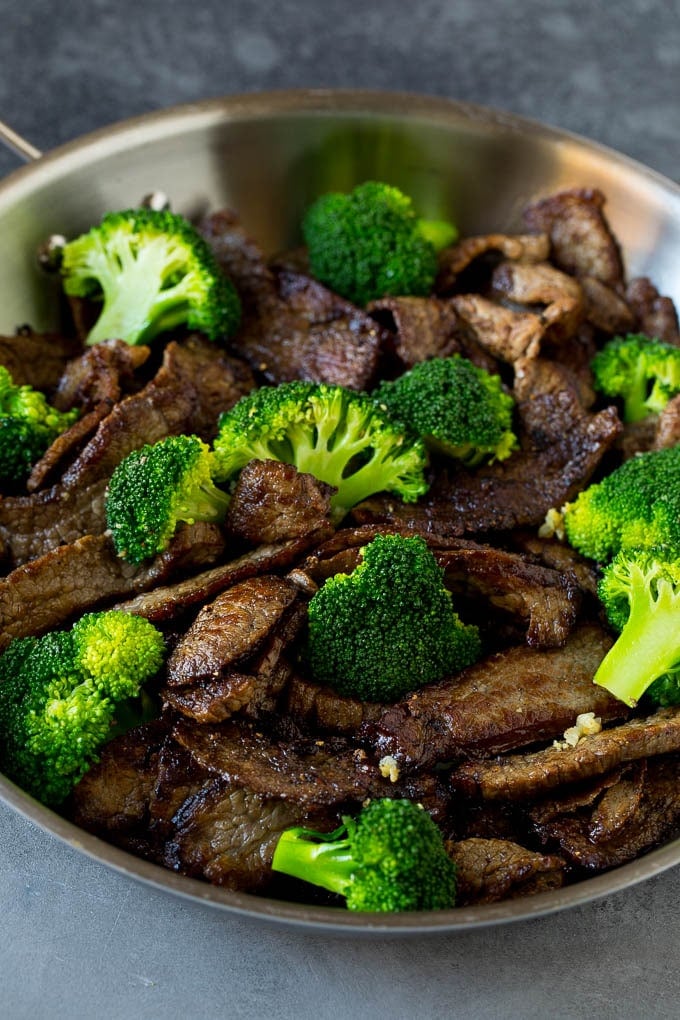 Steal and broccoli florets in a skillet.