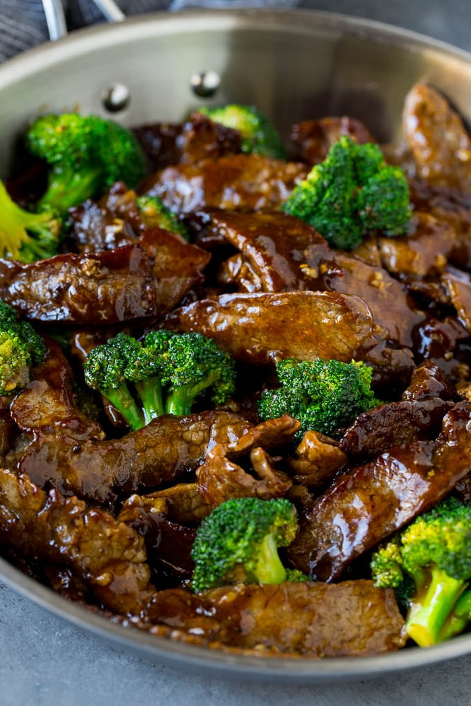 Beef and broccoli stir fry in a pan.