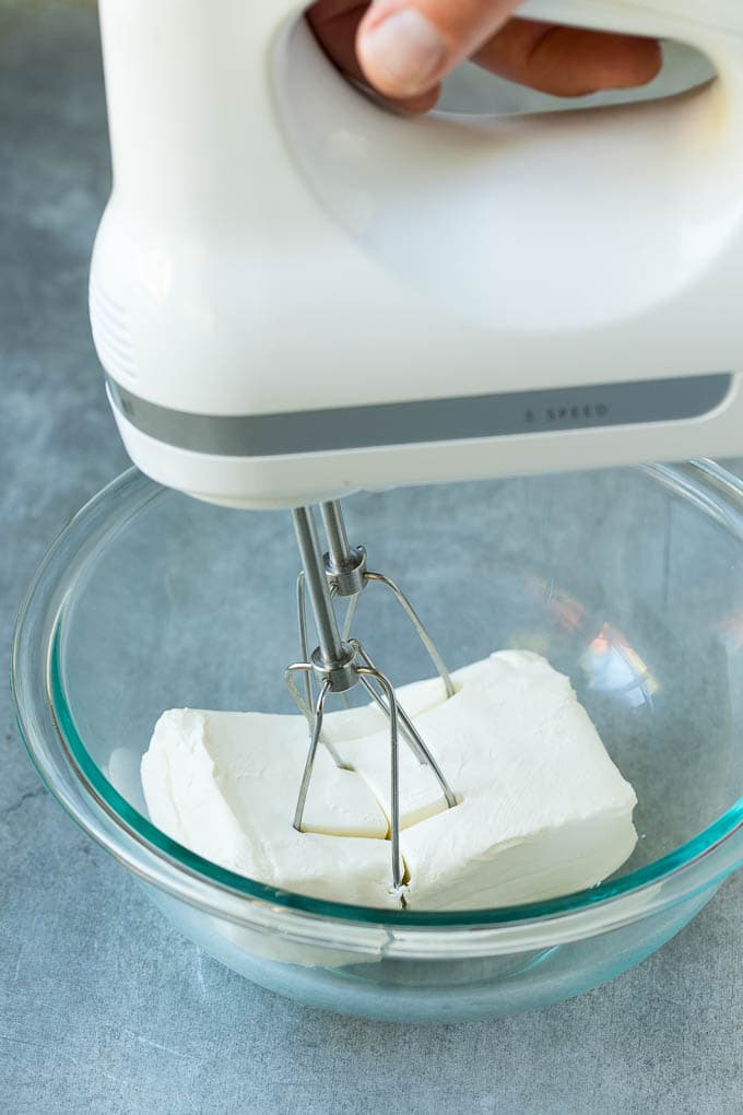 A mixer in a block of cream cheese.