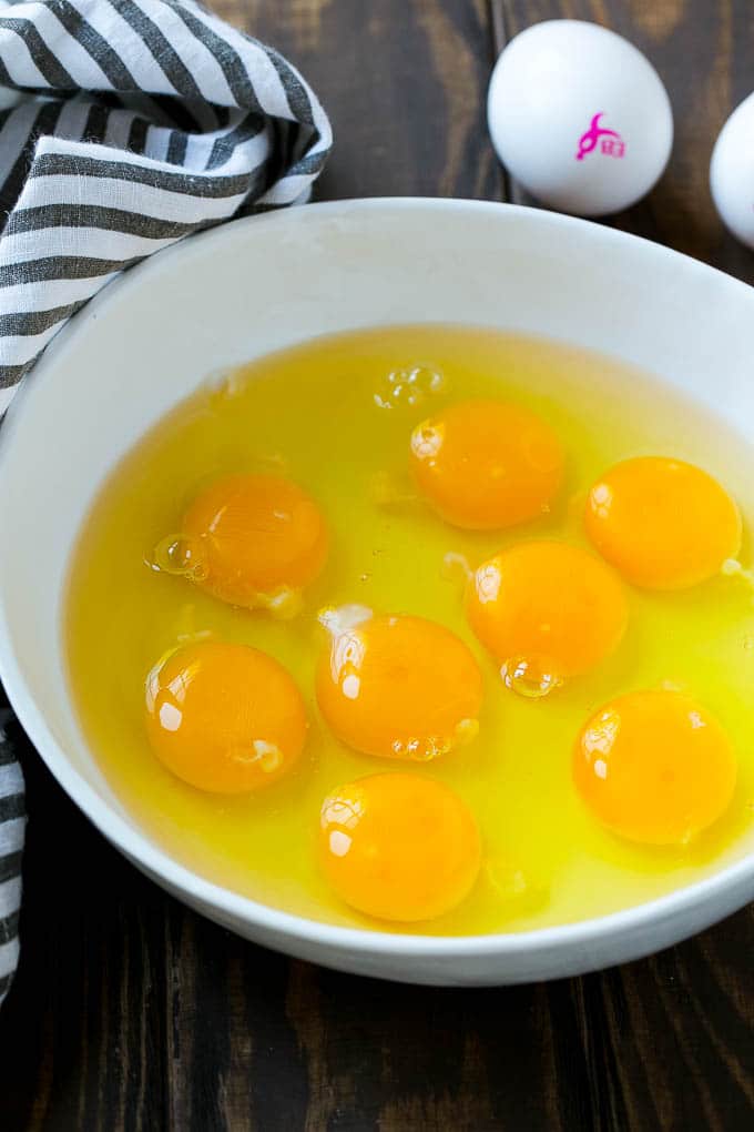 Eggs for Ham and Egg Casserole in a mixing bowl.