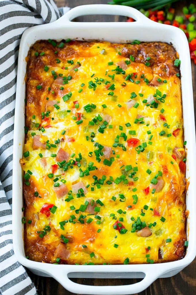 Hash brown egg casserole in a white baking dish.