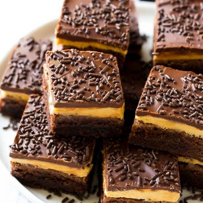 Peanut butter brownies with a chocolate brownie base, peanut butter frosting and fudge topping.