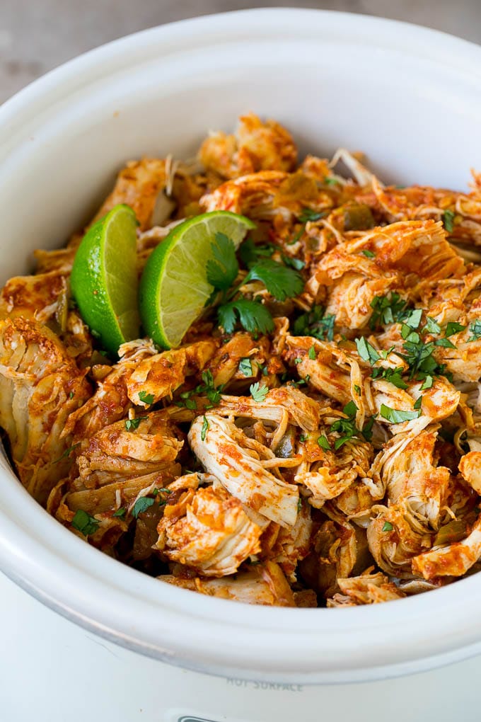 Shredded Mexican chicken in a crock pot.