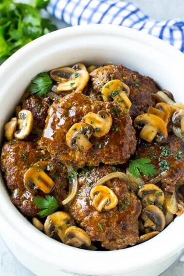 Slow cooker salisbury steak with mushroom gravy and onions.