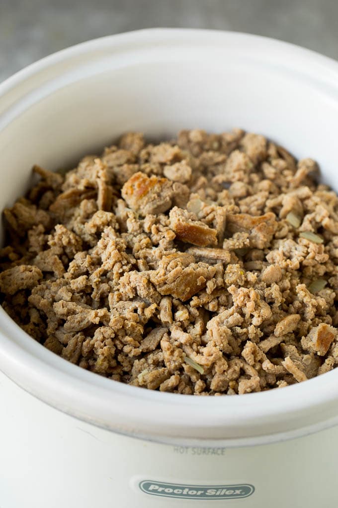 Ground turkey and onions in a slow cooker.