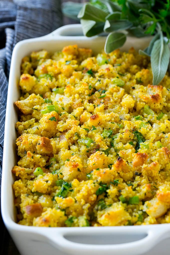 Southern Cornbread Dressing in a baking dish topped with chopped parsley.