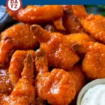 These crispy buffalo shrimp are breaded butterfly shrimp baked to golden brown perfection, then tossed in a three ingredient buffalo sauce.