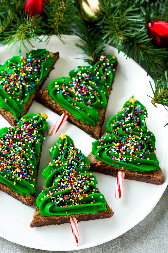 Christmas Brownies topped with green frosting and colored sprinkles.