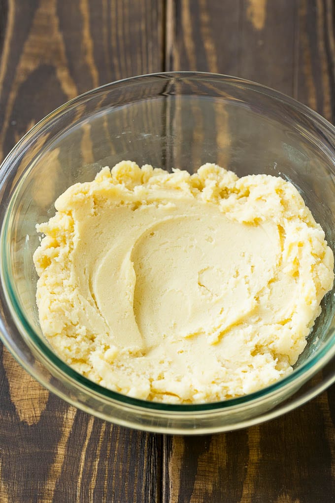 Spritz cookie dough in a mixing bowl.