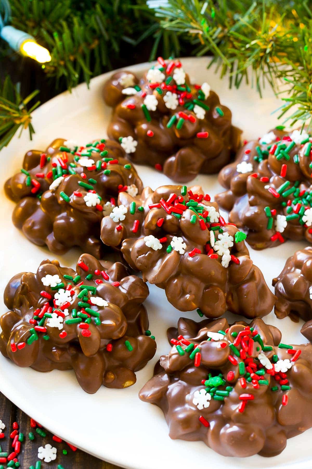 Chocolate peanut clusters on a plate.