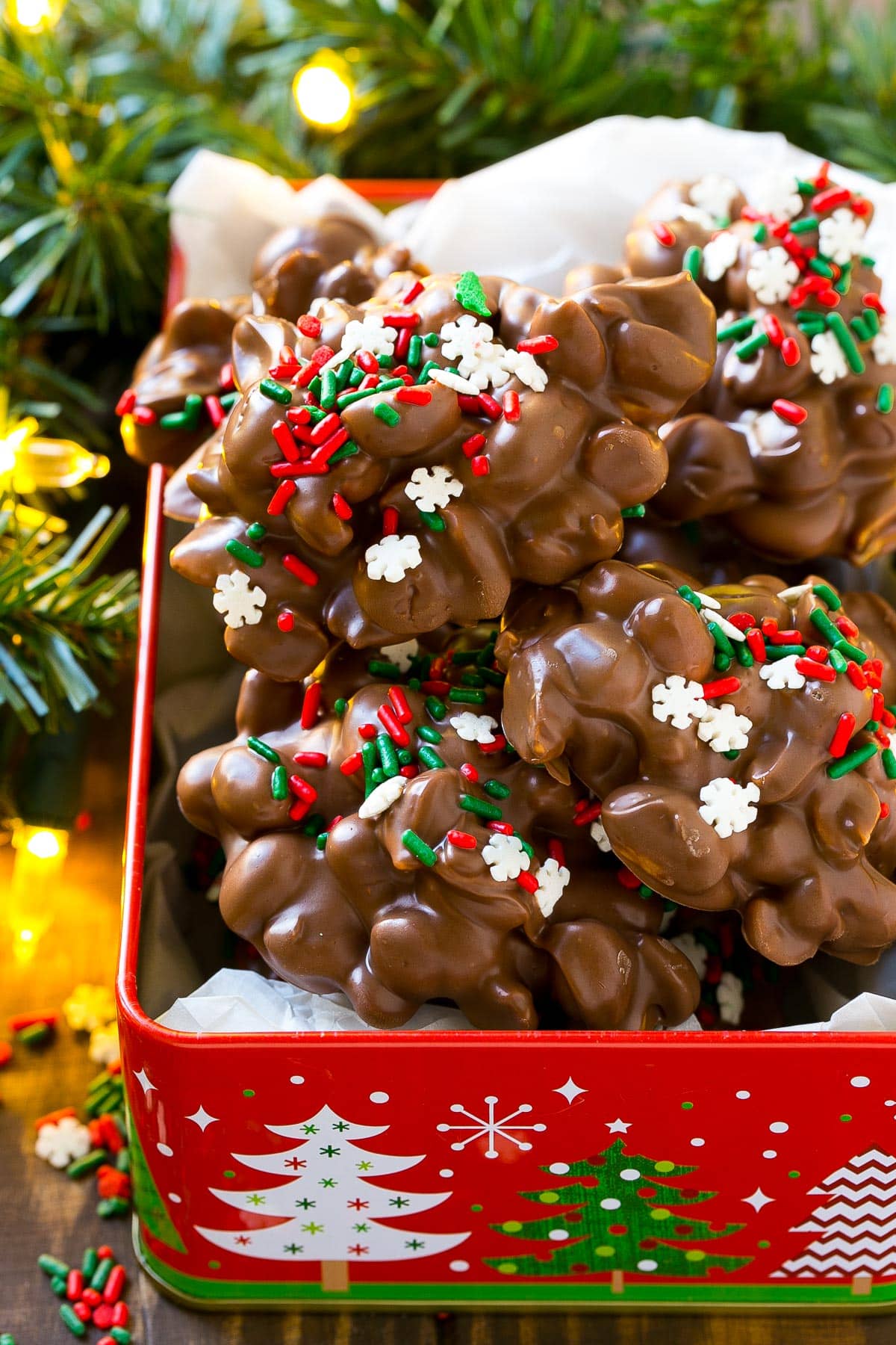 A holiday tin filled with crock pot candy.