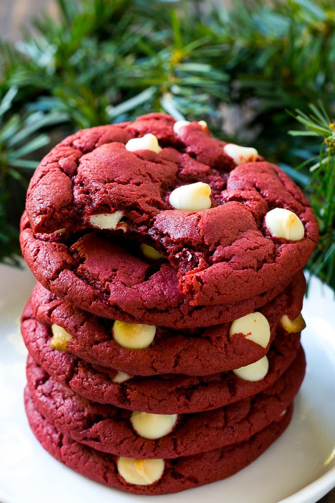 A stack of red velvet cookies on a plate.