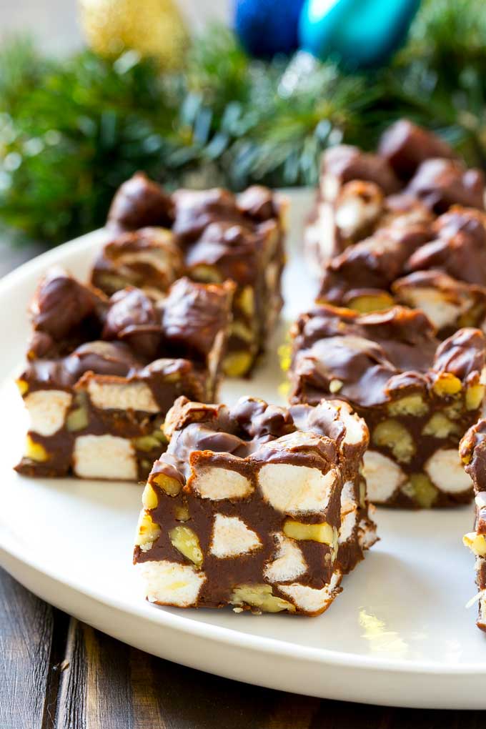 Squares of rocky road fudge on a serving plate.