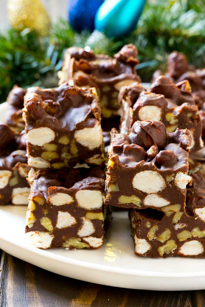Rocky Road Fudge cut into squares on a serving plate.