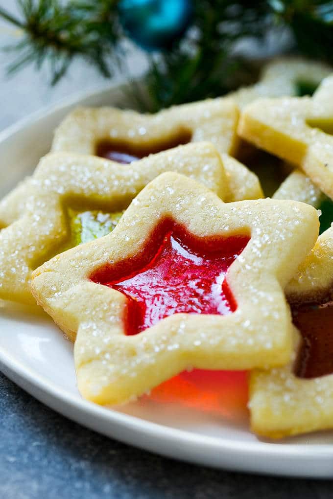 A star shaped cookie on a serving plate.