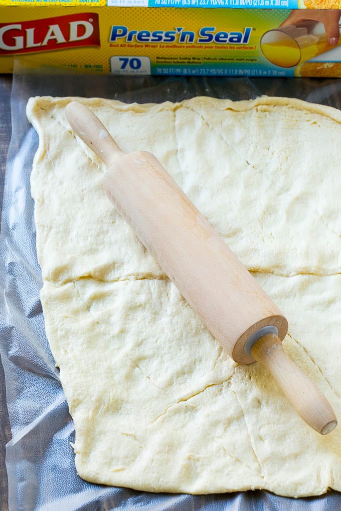 Crescent roll dough rolled out into a rectangle.