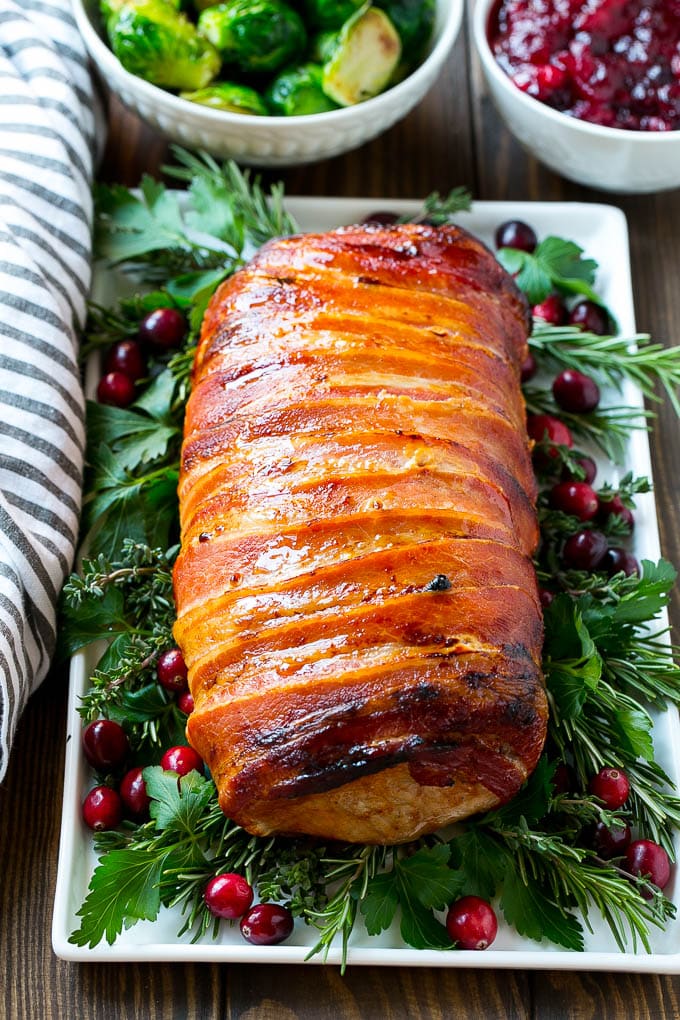 A bacon wrapped pork roast is the perfect easy holiday entree.