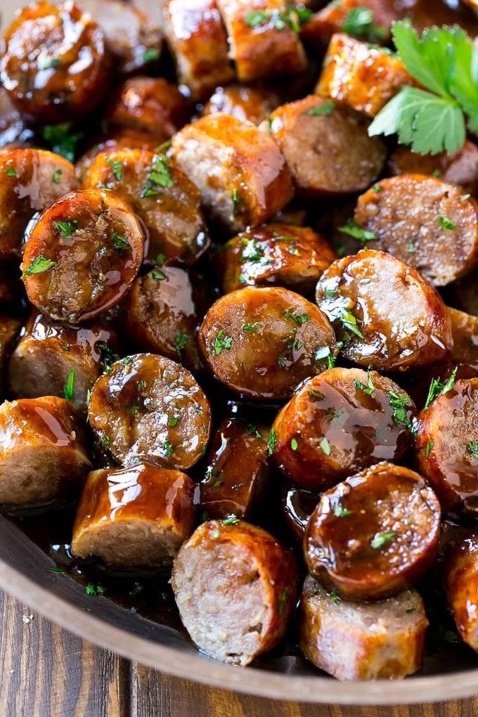 These beer brat bites are coated in a sweet and savory beer brown sugar glaze for a simple yet delicious snack.
