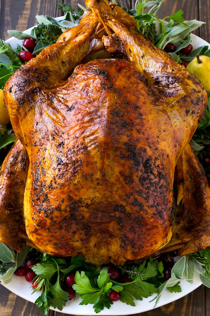 Herb roasted turkey is covered in butter and seasonings and baked to golden brown perfection.