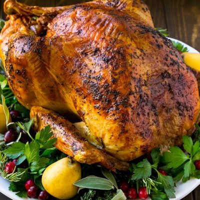 A whole herb roasted turkey is a show stopping main course for Thanksgiving or Christmas.