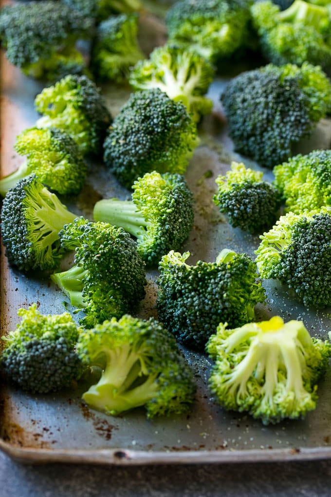 Parmesan roasted broccoli starts off with fresh broccoli florets, olive oil and seasonings.