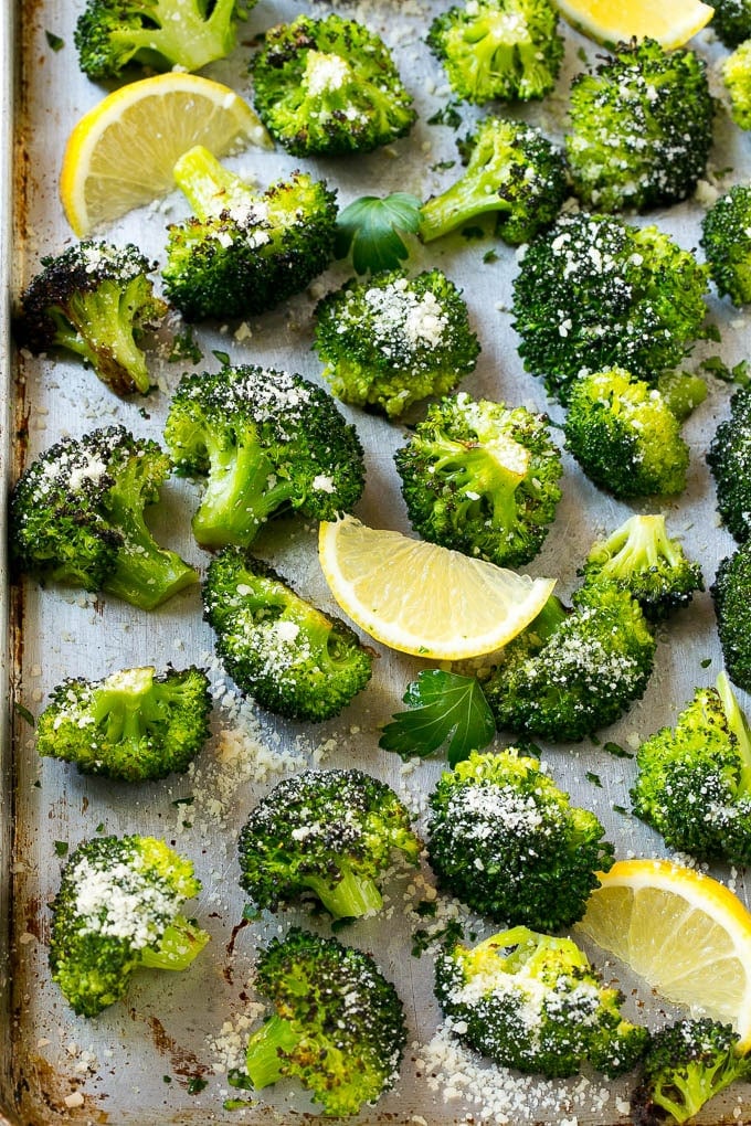 Serve your parmesan roasted broccoli with a sprinkling of cheese, parsley and fresh lemon juice.