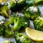 This parmesan roasted broccoli is seasoned with olive oil, parmesan and herbs. Put it in a hot oven and cook until tender and browned for the best broccoli you'll ever have!