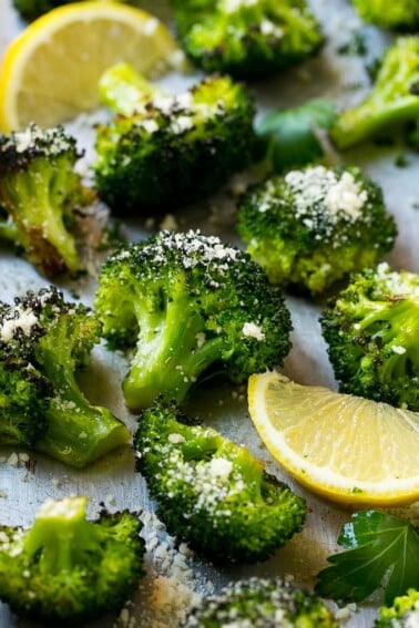 This parmesan roasted broccoli is seasoned with olive oil, parmesan and herbs. Put it in a hot oven and cook until tender and browned for the best broccoli you'll ever have!