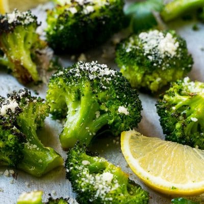 This parmesan roasted broccoli is seasoned with olive oil, parmesan and herbs. Put it in a hot oven and cook until tender and browned for the best broccoli you'll ever have!