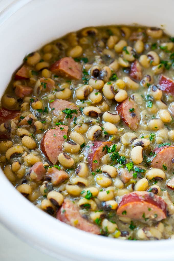 These crock pot black eyed peas with sausage and ham are the perfect meal for new years.