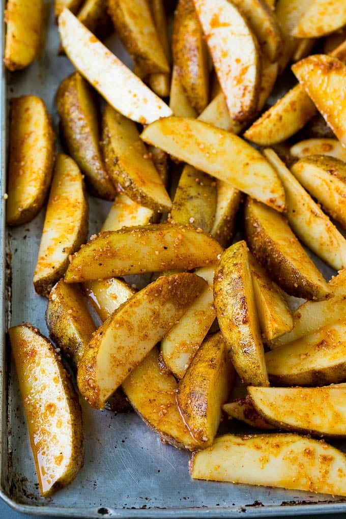 Potatoes coated in garlic, seasonings, olive oil and cheese.