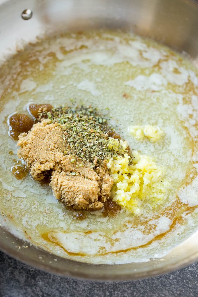 Melted butter, brown sugar, herbs and garlic form the sauce for pork chops.