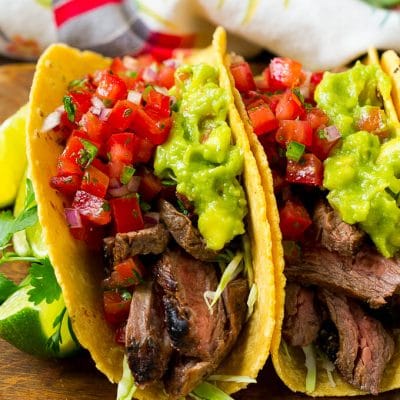 Carne asada tacos with grilled steak, cabbage, pico de gallo and guacamole.