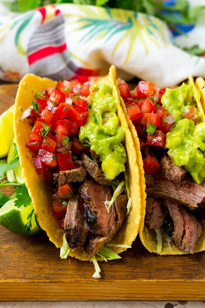 Carne asada tacos with grilled steak, cabbage, pico de gallo and guacamole.