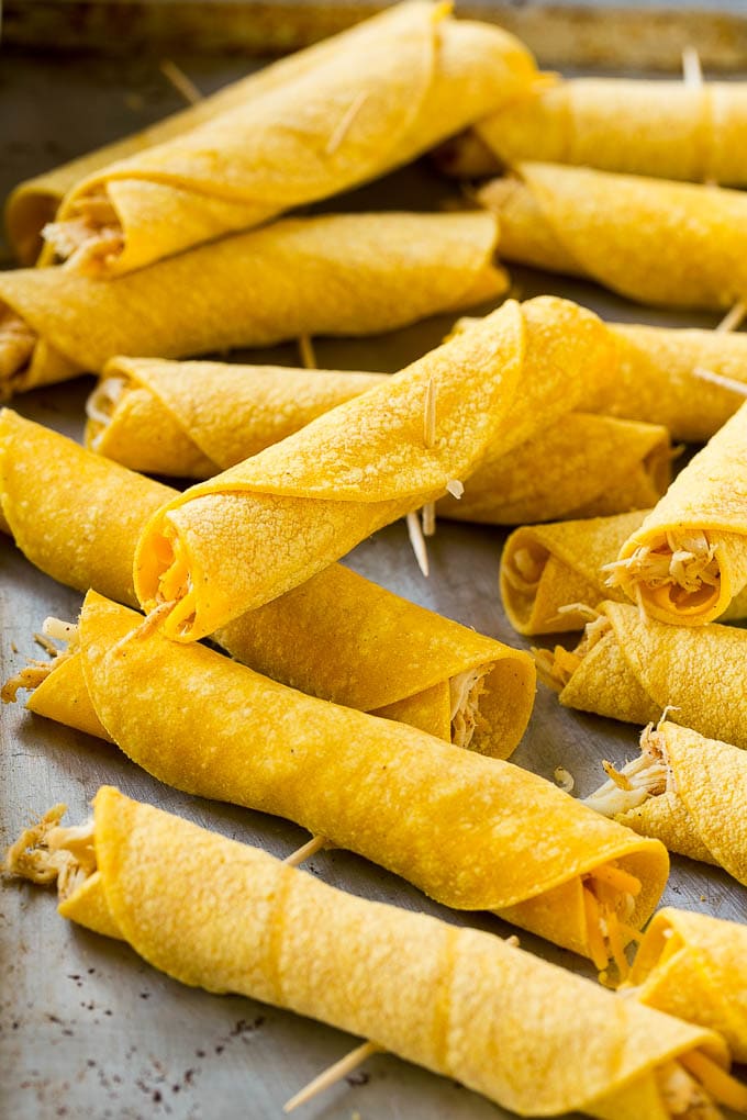 Rolled up chicken taquitos ready for the fryer or oven.