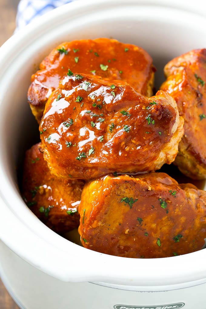 A slow cooker full of honey garlic pork chops.