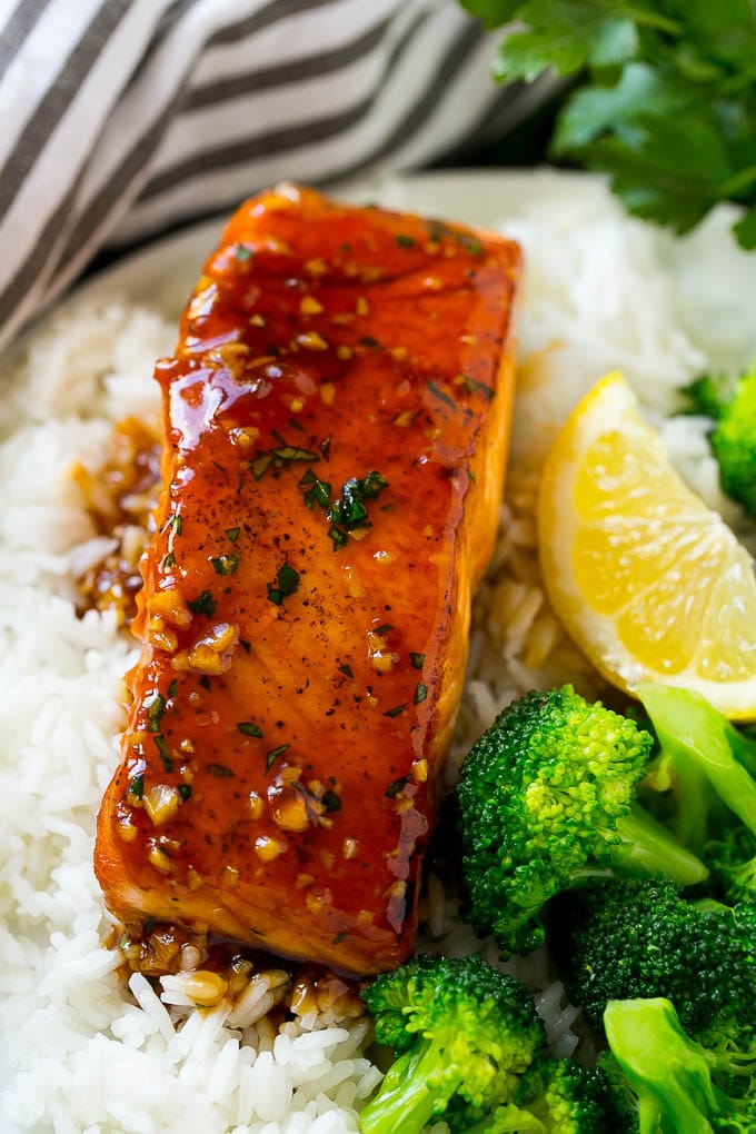 Honey garlic salmon served over rice with a side of broccoli.