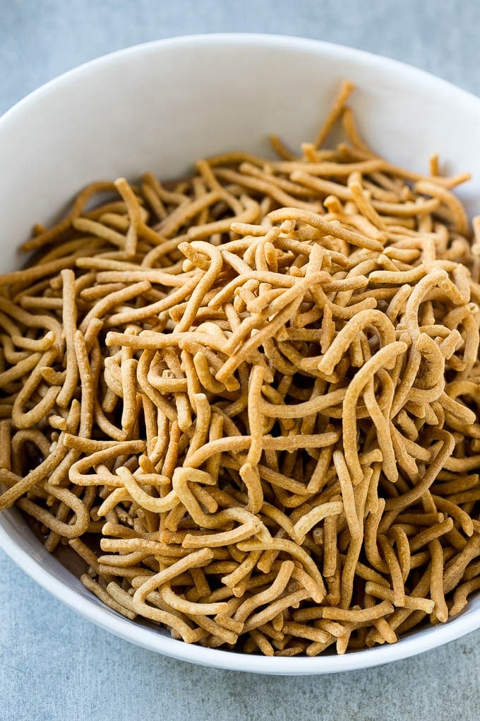 Chow mein noodles in a bowl of melted chocolate.